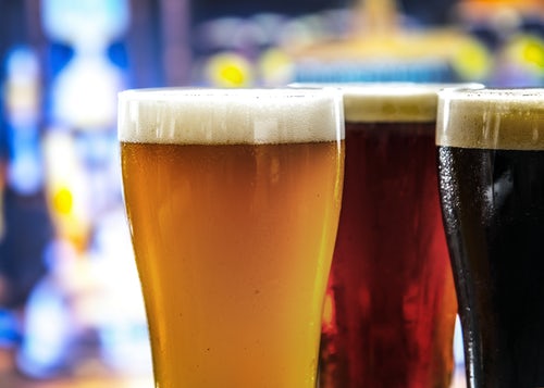 Three brewery beers on a table